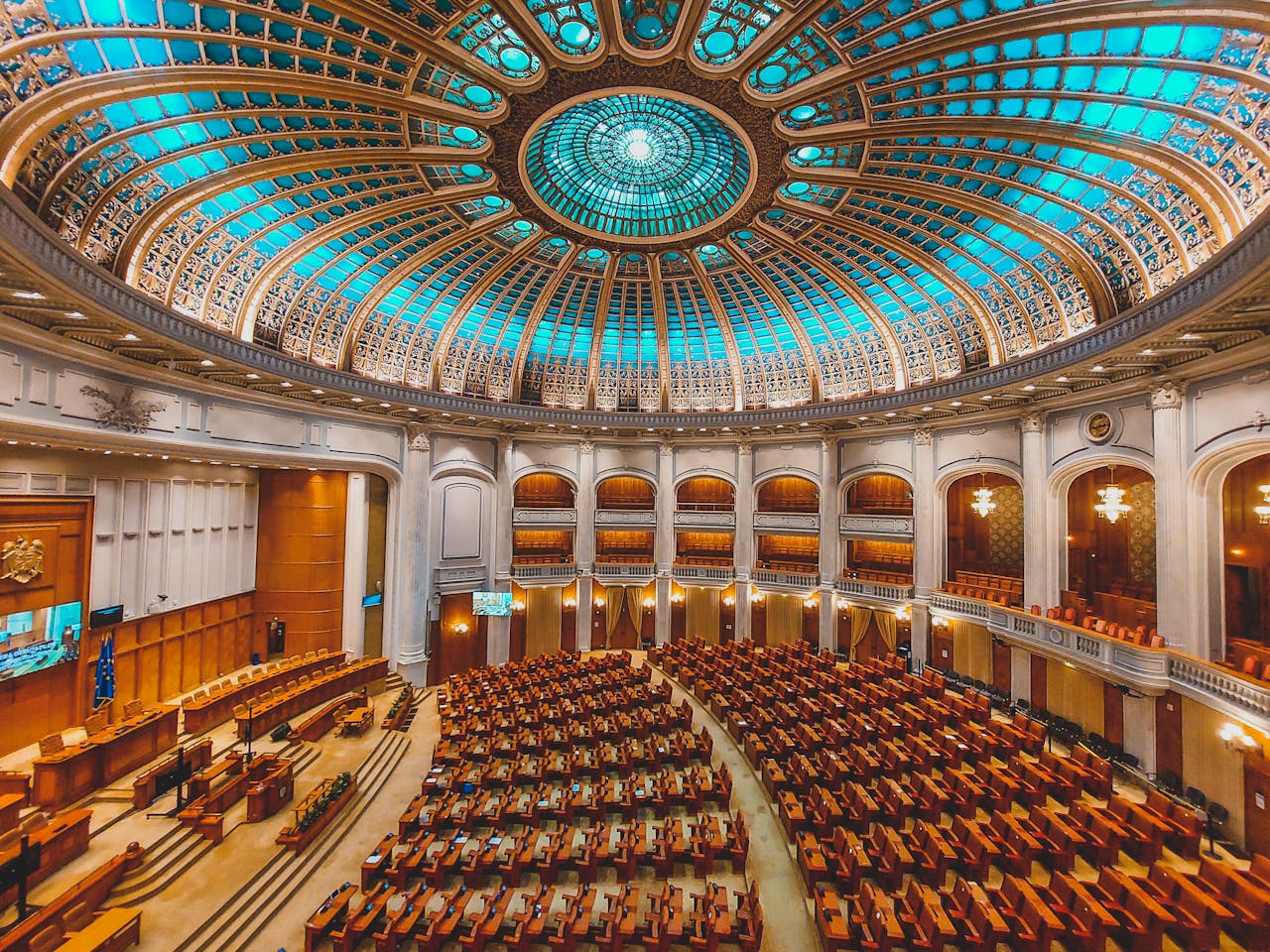 Mastering the First Impression: Your intriguing post title goes here Vibrant interior of a parliament hall with a grand dome and intricate architecture.